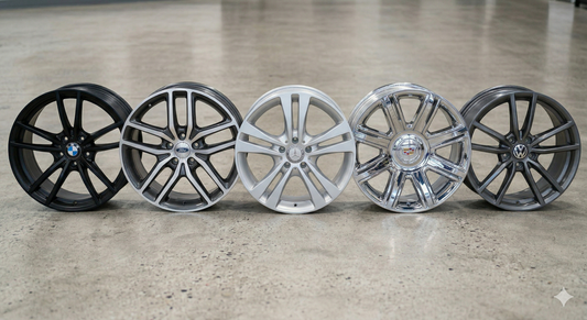 5 OEM car wheels showing different finishes and colors