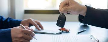 Off lease car giving his keys back to the car dealer